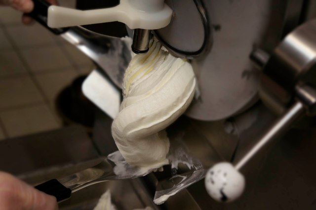 Cream (vanilla gelato) being  extruded by the gelato machine during the gelato making class at Mia Chef Gelateria in NYC