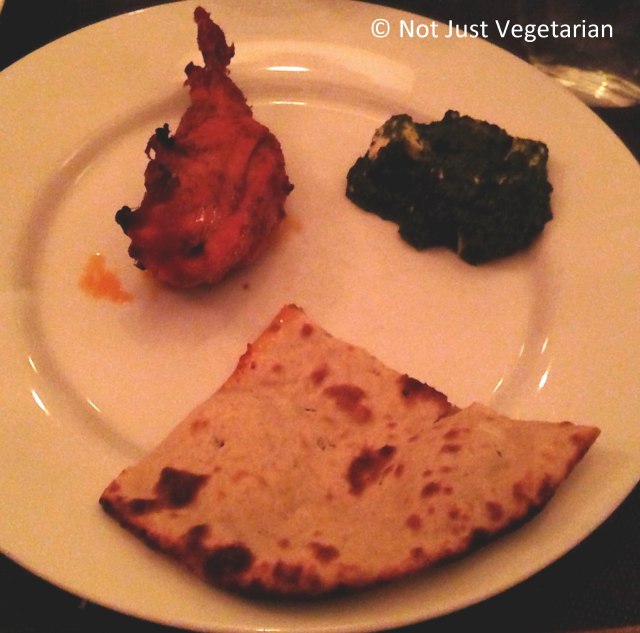 Plate of Tandoori roti, tandoori chicken and palak paneer (spinach and cottage cheese) at Moti Mahal Delux NYC