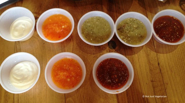 Crema and Salsas at Tres Carnes NYC - from Left to Right, Crema, Habanero salsa, salsa verde, and roasted tomato salsa